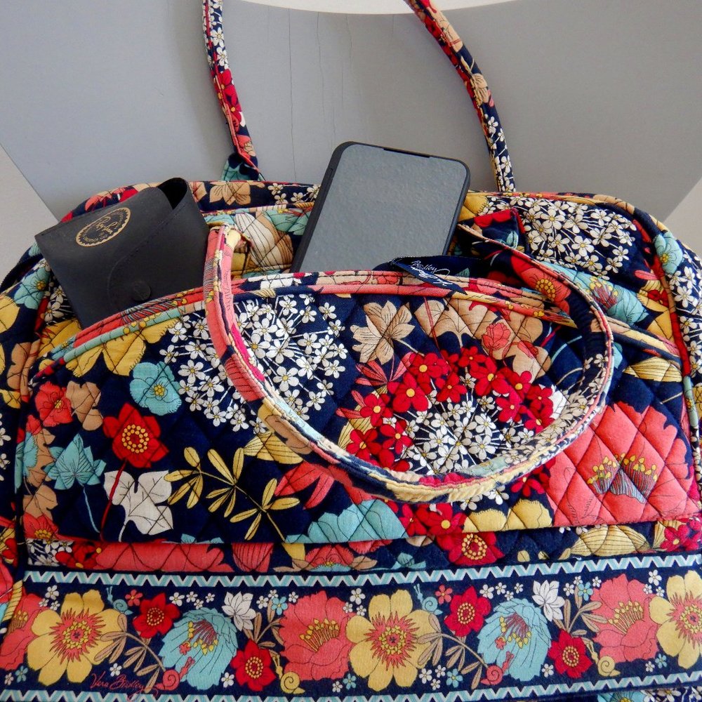 Vera Bradley: padded laptop/travel carry on bag.